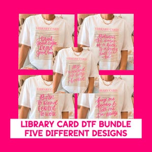 May include: A collection of white t-shirts, each featuring a pink library card design with different phrases. The phrases include "Drink Good Coffee Read Good Books," "Between the pages of a book is a lovely place to be," and "Buy me books & Tell me I'm pretty."