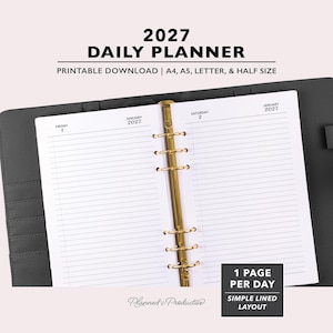 May include: A 2027 daily planner printable download featuring a black binder with a gold six-ring mechanism. The open white pages show a simple lined layout for Friday, January 1 and Saturday, January 2, 2027. Text includes 2027 DAILY PLANNER.
