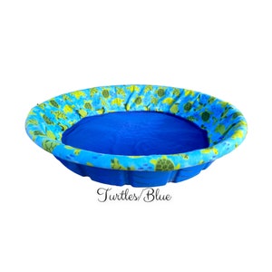 May include: A blue inflatable pool with a turtle and fish print lining. The pool is filled with water and the text "Turtles/Blue" is printed below the pool.