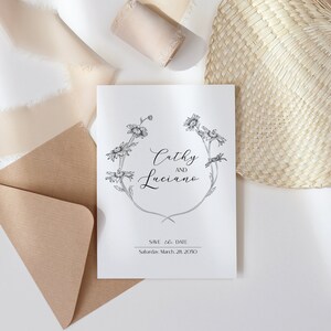 May include: A white wedding invitation with a black floral design and the text "Cathy and Luciano" and "Save the Date: Saturday, March 28, 2020".