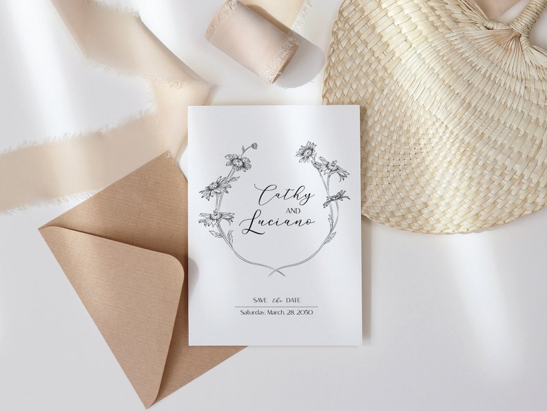 May include: A white wedding invitation with a black floral design and the text "Cathy and Luciano" and "Save the Date: Saturday, March 28, 2020".