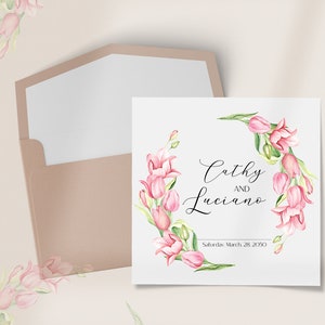 May include: A wedding invitation featuring a pink and green floral design. The invitation reads "Cathy and Luciano, Saturday, March 28, 2050".