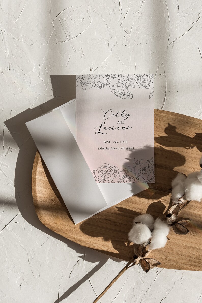 May include: A pink save the date card with a floral design and the text "Cathy and Luciano" and "Save the Date" with the date "Saturday, March 28, 2020".