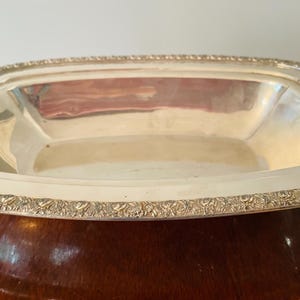 Vintage Silver plated rectangular serving dish with a decorative rim, appx 10 in long silver plate serving dish, good condition