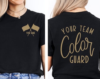 May include: Black t-shirt with gold text and graphic. The front of the shirt has two crossed flags with the text "YOUR NAME". The back of the shirt has the text "YOUR TEAM Color Guard".