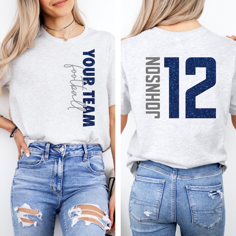 May include: Light gray t-shirt with the text "YOUR TEAM football" in navy blue and silver. The back of the shirt displays the name "JOHNSON" and the number "12" in navy blue.