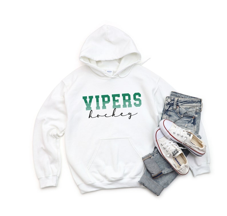 May include: White hoodie with a green and white striped graphic that says "VIPERS hockey" in a retro font.
