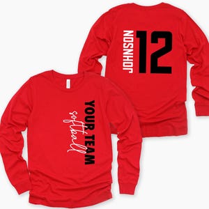 May include: Red long-sleeve t-shirt with black text that says "YOUR TEAM softball" on the left side and "JOHNSON 12" on the right side.