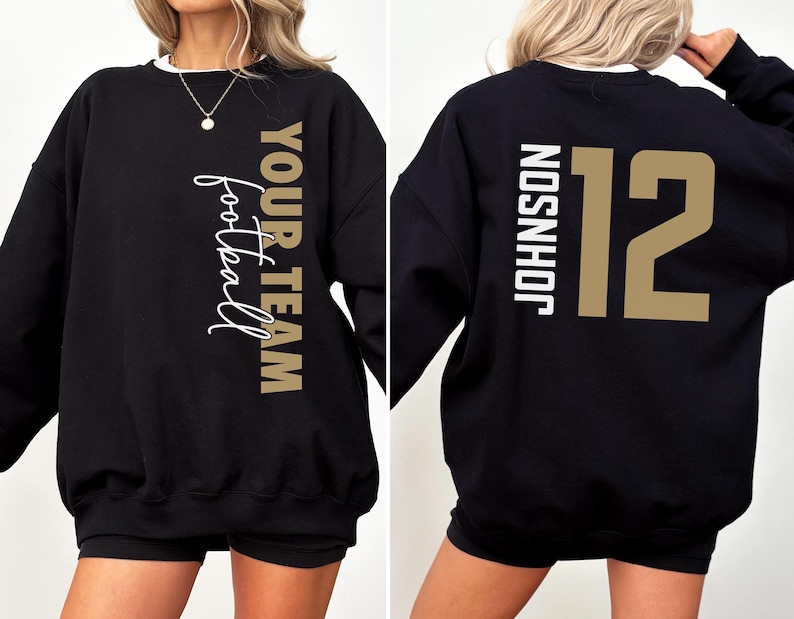 May include: Black sweatshirt with the text "YOUR TEAM football" in gold and white on the front. The back of the sweatshirt displays the name "JOHNSON" and the number "12" in gold.