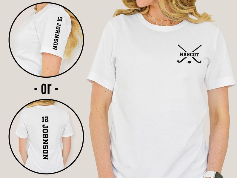 May include: White t-shirt with a black hockey stick graphic and the word "MASCOT" on the front. The back of the shirt has the number "12" and the word "JOHNSON" printed vertically.