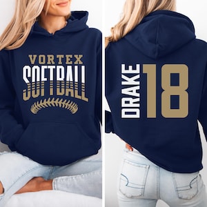 May include: Navy blue hoodie with a white and gold softball graphic on the front and the text "VORTEX SOFTBALL" and a white and gold "DRAKE 18" on the back.