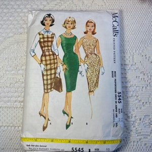 May include: Vintage McCall's sewing pattern for a dress or jumper. The pattern number is 5545 and the size is 12. The bust measurement is 32 inches. The pattern is printed on a white background with a black and white illustration of three women wearing different styles of dresses.