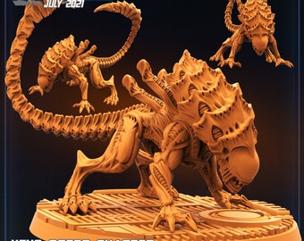 May include: A detailed, orange-brown plastic miniature of a Xenomorph Brood Charger from the Alien franchise. The creature has a long, segmented tail and a large, spiky head with a gaping mouth. The miniature is posed on a circular base with a textured surface.