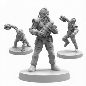 May include: Three unpainted gray resin miniature figures of bearded characters in tactical gear. One figure stands centrally holding a cylindrical device, while the other two are in dynamic poses, one crouching and one leaping with a multi-barreled weapon.