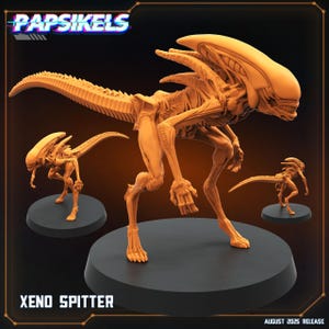 May include: A tan-colored Xeno Spitter figure, a creature from the Alien franchise, is displayed on a black base. The figure is highly detailed, showcasing its skeletal structure and elongated tail. The image includes the text "Xeno Spitter" and "August 2025 Release".