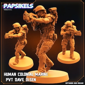 May include: Three 3D printed miniature figures of human colonial marines, each holding a futuristic rifle. The figures are painted in a muted brown color and stand on circular bases. The text "HUMAN COLONIAL MARINE PVT DAVE OLSEN" is printed below the figures.