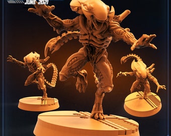 May include: A 3D printed miniature of a Xenomorph Brood Grabber from the Alien franchise. The figure is painted in a light brown color and is posed in a dynamic action pose. The figure is standing on a circular base with a textured surface. The text "XENO BROOD GRABBER" is printed on the base.