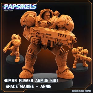 Puede incluir: Figura de color marrón anaranjado de un traje de armadura de poder humano Space Marine, llamado "Arnie". La figura sostiene un arma grande y está rodeada por dos figuras más pequeñas. El texto "Papsikels" está en la parte superior. El texto "December 2025 Release" está en la parte inferior.