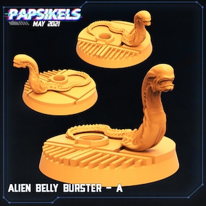 May include: A 3D printed miniature of an alien creature bursting from a human chest, painted in a light orange color. The miniature is on a circular base with a textured surface. The text "ALIEN BELLY BURSTER - A" is printed below the miniature.