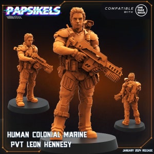 May include: A 3D printed miniature of a human colonial marine, holding a futuristic rifle. The miniature is painted in a brown colour and is standing on a black base. The text "HUMAN COLONIAL MARINE" and "PVT LEON HENNESY" is printed below the miniature.