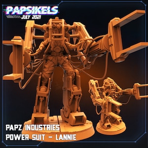 May include: A 3D printed model of a futuristic power suit with a human figure inside. The suit has large mechanical arms and legs, and the figure is wearing a helmet. The model is painted in a light brown color. The text "PAPZ INDUSTRIES POWER SUIT - LANNIE" is printed on the base of the model.