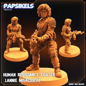 May include: A 3D printed miniature of a human resistance fighter holding a futuristic weapon. The figure is painted in a light brown colour and is standing on a circular base. The text "HUMAN RESISTANCE FIGHTER LANNIE MISALOUCHE" is printed below the figure.