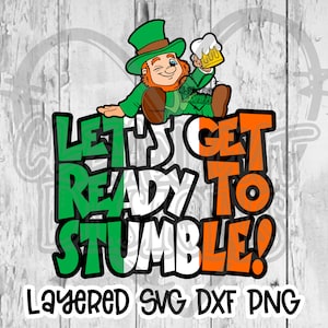 May include: A green leprechaun with a green hat and a beer mug in his hand, sitting on top of the words "Let's Get Ready To Stumble!" in green, white, and orange colors. The words are layered on top of each other, creating a layered effect. The words "Layered SVG DXF PNG" are written below the main text.