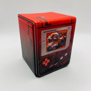 May include: Red and black game box with a white stitched border. The box features a retro video game design with a character graphic on the front. The text "ooochenDIY GAMEBOX" is visible.