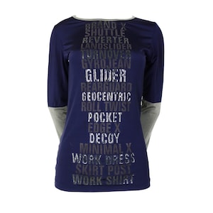 May include: A navy blue long-sleeved shirt with a gray print of the words "Brand X Shuttle Reverter Landslider Turnover Gyrojean Glider Rearguard Geocentric Roll Twist Pocket Edge X Decoy Minimal X Work Dress Skirt Post Work Shirt".