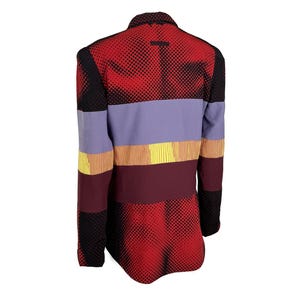 May include: A striking blazer with a distinctive design. The back of the jacket showcases a red and black dotted pattern, complemented by horizontal stripes of lavender, yellow, and burgundy. The sleeves are black with a dotted pattern.