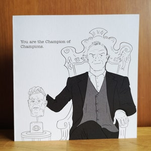 Greg Davies Taskmaster Champion of Champions-wenskaart met TM-lakzegelsticker