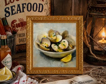 May include: A framed oil painting depicting a bowl of steamed clams garnished with fresh green herbs and a wedge of lemon. The artwork is presented in an ornate gold-colored frame, showcasing a culinary scene with textured brushstrokes.