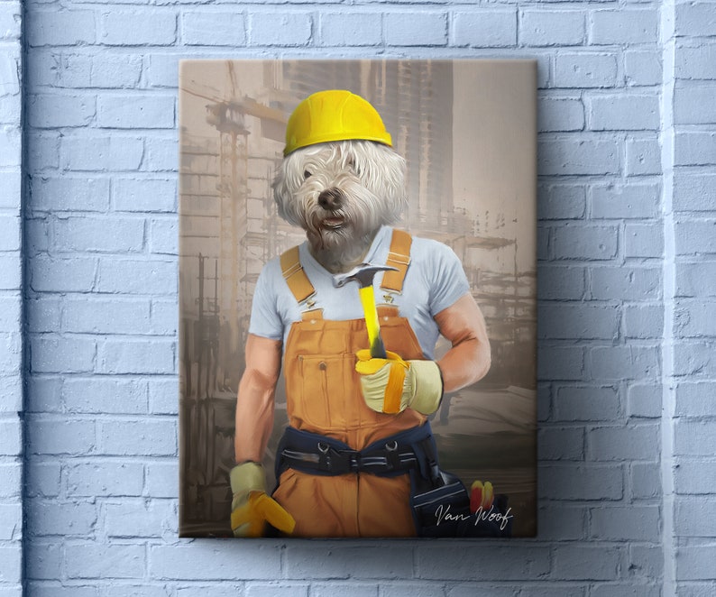 May include: A white dog wearing a yellow hard hat and blue and orange construction worker overalls holds a yellow hammer in a construction zone.