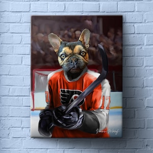 May include: A canvas print featuring a French Bulldog dressed as a hockey player. The dog wears an orange jersey with the number 17 and holds a hockey stick. The background shows a hockey rink and a crowd.
