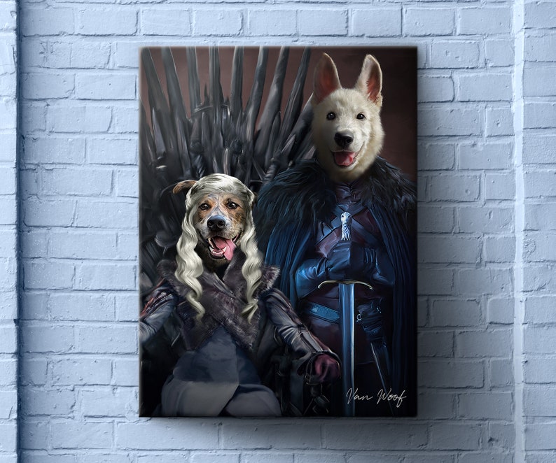 May include: Two dogs dressed as characters from the TV show Game of Thrones. A white dog is dressed as Jon Snow, holding a sword and wearing a blue cloak. A brown and white dog is dressed as Daenerys Targaryen, wearing a long blonde wig and a black cloak. The dogs are sitting on the Iron Throne.