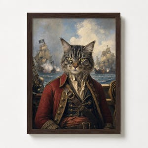 May include: A framed print featuring a cat in a pirate costume, set against a backdrop of a naval battle. The cat, with gray and brown fur, wears a red coat, a white shirt, and a sword. The artwork is in a dark wooden frame.