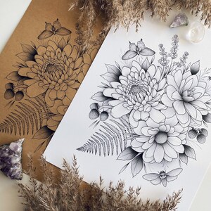 May include: A black and white line drawing of a floral bouquet with butterflies, berries, and ferns. The bouquet is arranged in a circular shape and features a large chrysanthemum in the center.