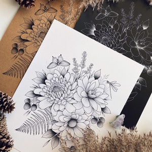 May include: A black and white line drawing of a bouquet of flowers, including dahlias, ferns, and a dragonfly. The drawing is on a white background and is surrounded by pine cones and dried grasses.