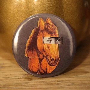 Suspicious Horse button badge