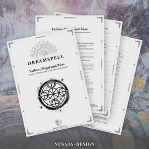 May include: A stack of white paper documents with the title "DREAMSPELL" and the text "Farben, Siegel und Töne" in black. The documents feature decorative borders and a circular graphic. The bottom of the documents have the text "NESAJA DESIGN".