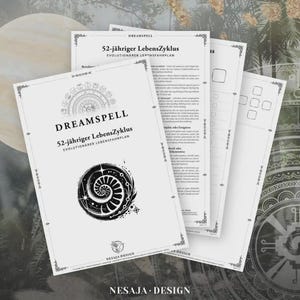 May include: A stack of white paper sheets with the title "DREAMSPELL" and "52-jähriger LebensZyklus" in black text. The cover features a spiral design and the "NESAJA DESIGN" logo. The background has a blurred, decorative pattern.