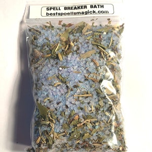 May include: A clear plastic bag filled with blue bath salts and green herbs. The bag has a white label that reads "SPELL BREAKER BATH" and "bestpoellsmagick.com".