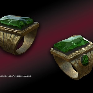 May include: Two gold rings with large, faceted green gemstones. The rings have a textured band and a square setting for the gem. The background is a gradient of dark red to black.