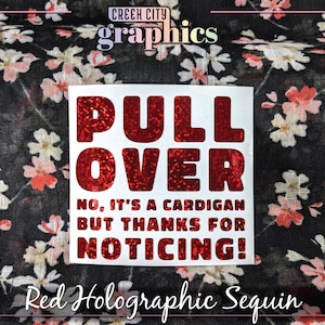 May include: Red holographic sequin sticker with the text "PULL OVER NO, IT'S A CARDIGAN BUT THANKS FOR NOTICING!"