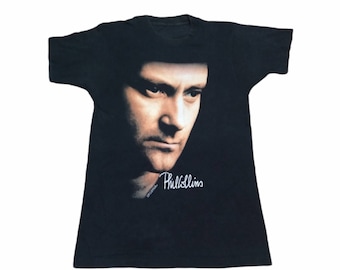 トップス 1990s Vintage Phill Collins Tee BROCKUM Vintage 1990s Phil Collins Bug Face Tee Shirt Black Faded Single