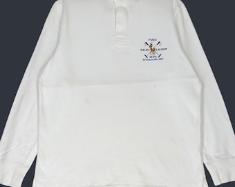 Polo Ralph Lauren Rugby Vintage, color blanco, talla M. Camisa polo de manga larga con logo bordado, color blanco.