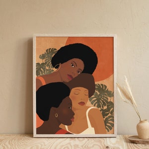 May include: A framed illustration of three Black women with afro hairstyles. The women are depicted in profile, with the woman in the back leaning her head on the shoulder of the woman in the middle. The background is a warm orange color with green leaves.