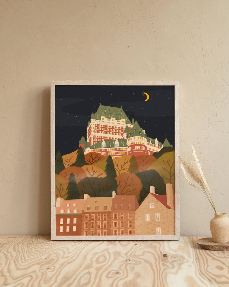 May include: A framed illustration of a castle-like building with a crescent moon in the night sky. The building is surrounded by trees and smaller buildings. The colors are muted and warm, with shades of brown, green, and yellow.