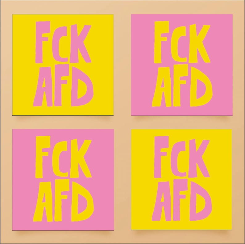 May include: Four square sticky notes with the text "FCK AFD" written in pink on a yellow background and yellow on a pink background.