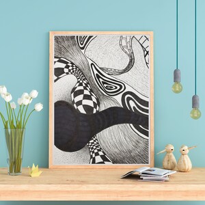 May include: Black and white abstract line art drawing in a wooden frame. The drawing features a series of swirling lines and shapes, including a checkered pattern.